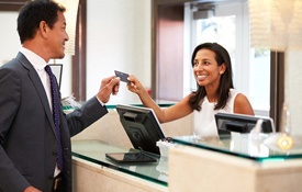 A dental patient paying for care via CareCredit in Petaluma.