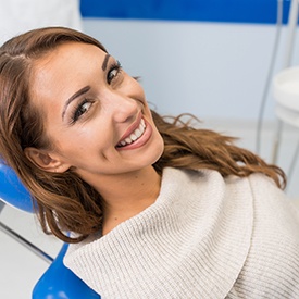 Smiling woman relaxing in treatment chair