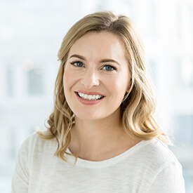 woman in white smiling