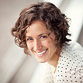 woman wearing polka dots smiling