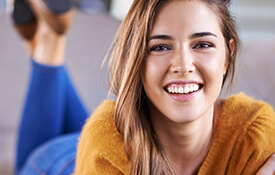 girl laying down smiling