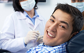 teen boy smiling in exam chair