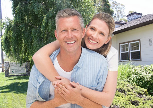 husband and wife smiling