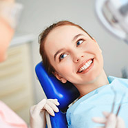 girl laying in dental chair