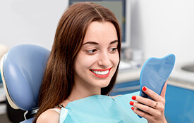 woman smiling in mirror