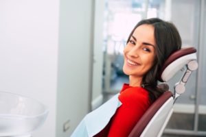 Woman smiling in her dentist’s chair