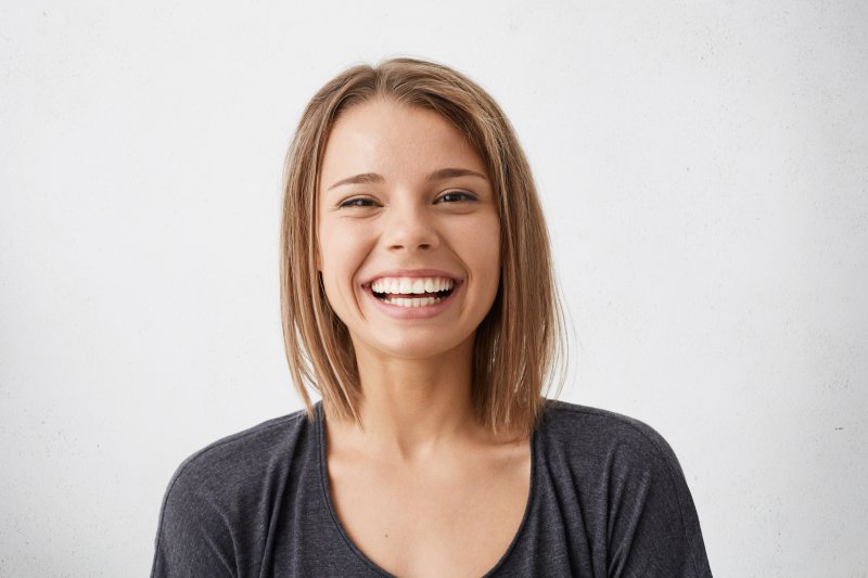 person who had root canal therapy smiling