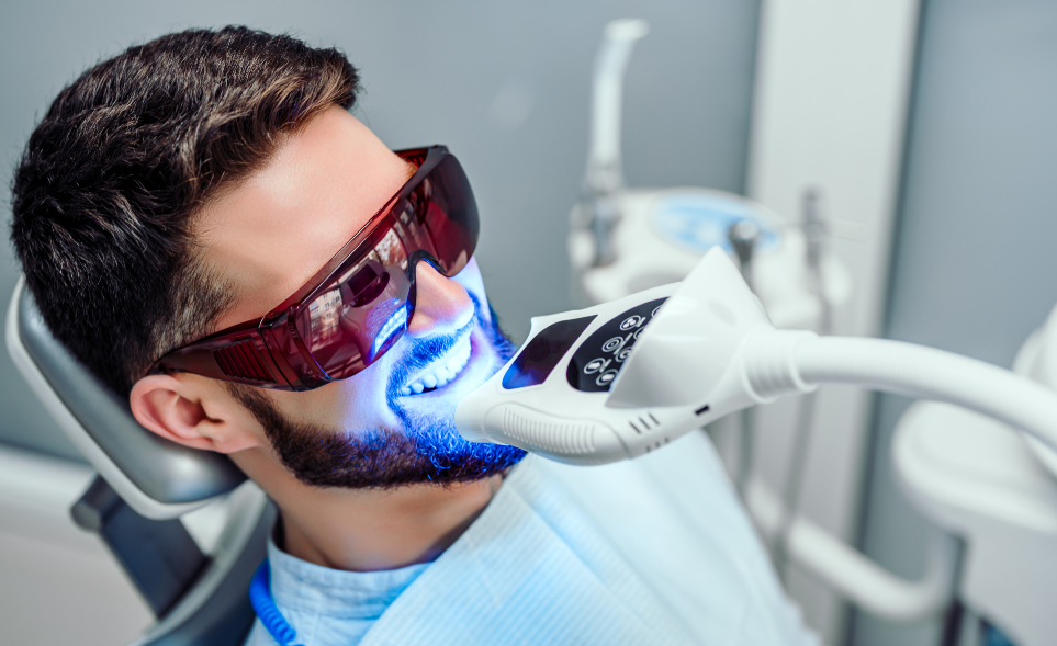 Man undergoing professional whitening treatment