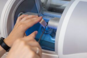 Dentist putting ceramic block in CEREC machine